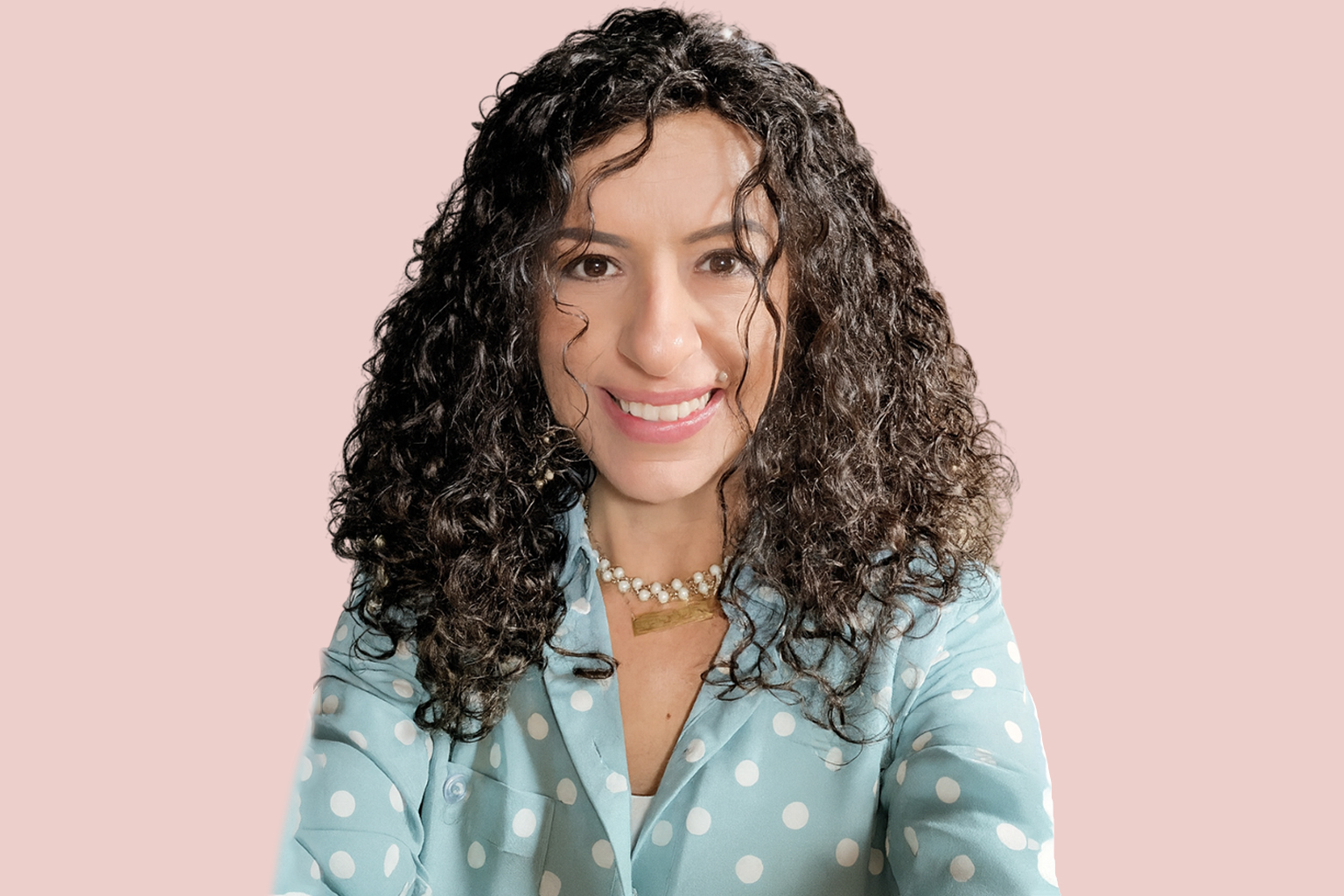 Client wearing a curly wig made from her own hair